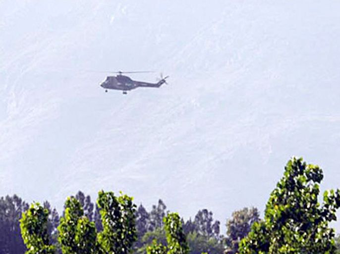 AFP - A Pakistani army helicopter flies in the troubled area in Lower Dir on April 27, 2009, where troops killed 20 militants in a ground and air operation against Taliban. The Pakistan