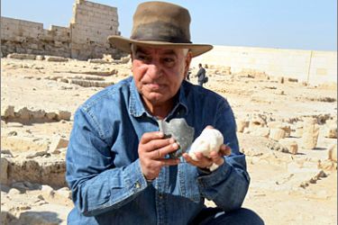 AFP - Zahi Hawass, the head of Egypt's Supreme Council of Antiquities, shows a bust believed to be of Cleopatra and a mask of Marc Anthony found at the temple of Tasposiris Magna near Borg al-Arab, 50 kms (30 miles) west of