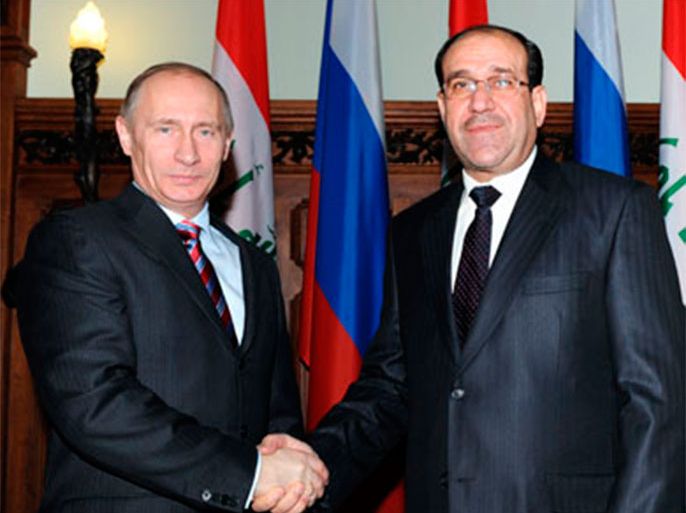 Russian Prime Minister Vladimir Putin (L) shakes hands with Iraqi Prime Minister Nuri al-Maliki (R) in Moscow on April 10, 2009. Iraqi Prime Minister Nuri al-Maliki was to hold summit