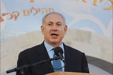 f_A handout picture released by the Israeli Government Press Office (GPO) shows Israeli Prime Minister Benjamin Netanyahu giving a speech durnig