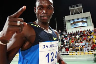 f_Sudan's Abubaker Kaki celebrates after winning the men's 800m race at the Qatar Super Grand Prix in Doha late on May 8, 2009