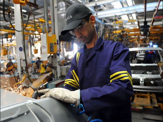 afp : A worker is pictured in a Dacia-Sandero workshop in the Samoca factory in Casablanca on June 3, 2009. The Dacia Sandero a subsidary of the Renault company, made in the