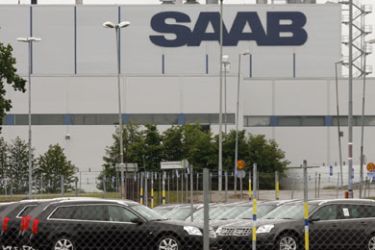 New Saab automobiles are parked in a storage lot outside the main Saab factory in Trollhattan June 10, 2009. General Motors Corp' Saab Automobile unit has narrowed talks