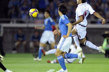 Qatar's defender Ahmed Alif al-Binali (R) scores an own goal during their 2010 World Cup Asia Group A qualifier match against Japan in Yokohama