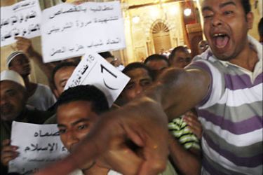 Protesters shout anti-German and pro-Islamic slogans inside Al-Azhar Mosque in Cairo July 10, 2009 in a demonstration against the killing of Egyptian woman Marwa