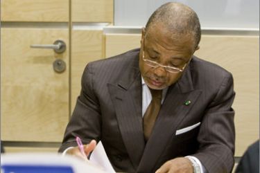 Former Liberian President Charles Taylor sits in the courtroom of the International Criminal Court prior to the beginning of his defense case during his trial in The Hague July 13, 2009.