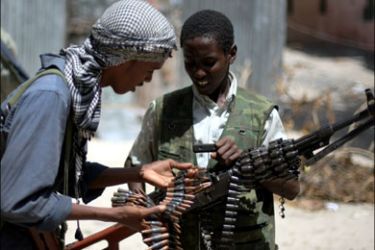 afp : Young fighters from Al-Shabab come together to count their bullets at a frontline section in Sinaya Neighborhood in Mogadishu, on July 13, 2009. According to the Islamist