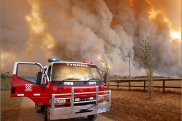 This file photo taken on February 7, 2009 shows Country Fire Authority (CFA) staff monitoring a giant fire raging in the Bunyip State Park near Labertouche, some 125 kilometres west of Melbourne
