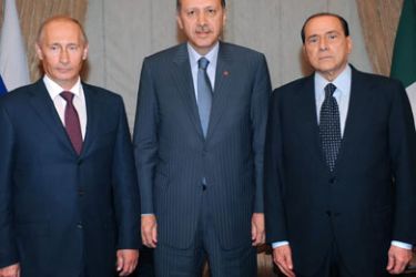 Russian prime minister Vladimir Putin (L) and his counterparts Turkish Recep Tayyip Erdogan (C), Italian Silvio Berlusconi porse for the media after their meeting in Ankara,