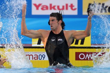 US swimmer Michael Phelps reacts after the men's 100m butterfly final on August 1, 2009 at the FINA World Swimming Championships in Rome.Phelps won gold and set a new