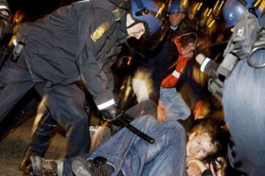 Danish police clash with demonstrators supporting of a group of rejected Iraqi asylum seekers early on August 13, 2009 outside of Brorsons Church in Copenhagen.