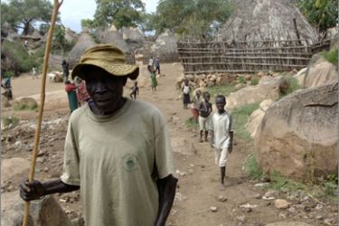 A Sudanese man walks in the village of Lobira Boma in south Sudan's Eastern Equatoria state on October 2, 2009