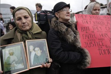 Bosnian women stage a protest in The Hague at the start of the trial against Radovan Karadzic at the War Crimes Tribunal in The Hague on October 26, 2009