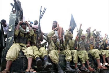 Hardline Islamist fighters from Al-Shabab chant slogans as they rally in the streets of Mogadishu on October 30, 2009 to show their support for Palestinian people and denounce the October 25, 2009