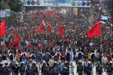 Maoist activists chant slogans and wave flags during an anti-government protest rally in Kathmandu on November 13, 2009.