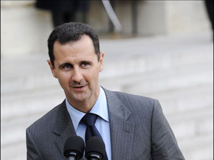 Syria's President Bashar al-Assad speaks to the media in the courtyard at the Elysee Palace following a meeting with France's President Nicolas Sarkozy in Paris November 13, 2009.