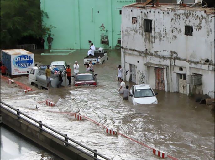 afp - People are stranded in a flooded area in the Saudi Red Sea city of Jeddah on November 25, 2009. Saudi Arabia's civil defence said on November 26 that 77 people were killed in intense flooding after a downpour in Jeddah and nearby areas, and that scores could still be missing