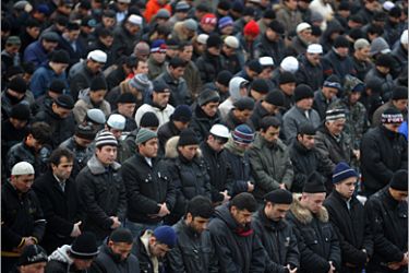 Muslim men pray during the Eid al-Adha (Kurban Bairam in Russian) festival of sacrifice holiday in Moscow on November 27, 2009. Eid-al-Adha, the festival of sacrifice, is