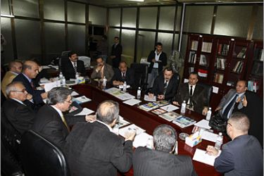 Faraj al-Haidari (3rd-R in grey suit), the head of the Independent High Electoral Commission (IHEC), listens on during a meeting of the judiciary committee as they discuss