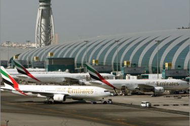 Airplanes of Emirates Airlines stand at the terminal 3 of Dubai Airport in Gulf Emirate of Dubai, United Arab Emirates, 31 December 2008. The government