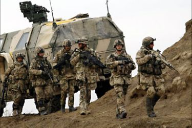 German Bundeswehr army soldiers of the International Security Assistance Force (ISAF) conduct a mission in Chahar Dara in the outskirts of Kunduz, December 18, 2009