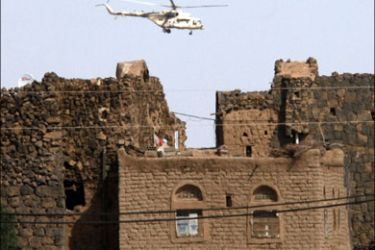 afp : A Yemeni army helicopter flies over the district of Arhab in the Sanaa province after security forces carried out operations against Al-Qaeda suspects on December 17,