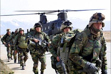 AFP (FILES) This file photo taken on March 11, 2002 shows US soldiers returning from the Gardez battlefield as they exit a Chinook helicopter which has just transported them back to
