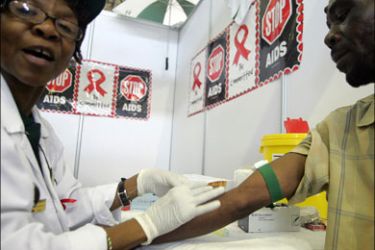 afp : A man takes an HIV test on December 1, 2009 at aWorld Aids day event in Pretoria. South African President Jacob Zuma said Tuesday that he will receive an HIV test,