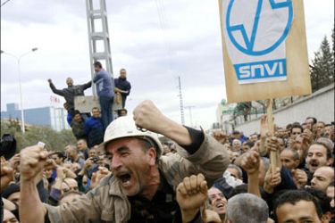 r : Benmouloud Ameziane, union leader for the state-owned National Company of Industrial Vehicles (SNVI), gestures during a strike at Rouiba, in Algiers January 7, 2010. About