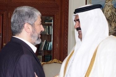 A handout picture released by the Qatari News Agency (QNA) shows Qatari Emir Hamad bin Khalifa al-Thani (R) welcoming Palestinian exiled Hamas leader Khaled Meshaal in Doha on January 10, 2010.