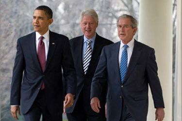 US President Barack Obama (L) walks down the West Wing Colonnade alongside former US Presidents Bill Clinton (C) and George W. Bush (R) before speaking about joint relief efforts following the earthquake in Haiti, during a statement in the Rose Garden of the White House in Washington, DC, on January 16, 2010. Obama said the former presidents would lead a fundraising effort