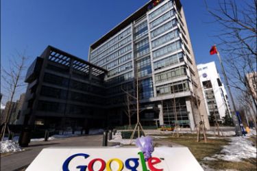 afp : A bouquet of flowers, notes and commentaries are placed on the company logo outside the Google China headquarters in Beijing on January 14, 2010. Google vowed