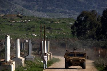 afp : An Israeli army humvee patrols on January 6, 2010 the outskirts of the Israeli occupied village of Ghajar, which sits on the border of Lebanon, Israel and Syria. Located on the