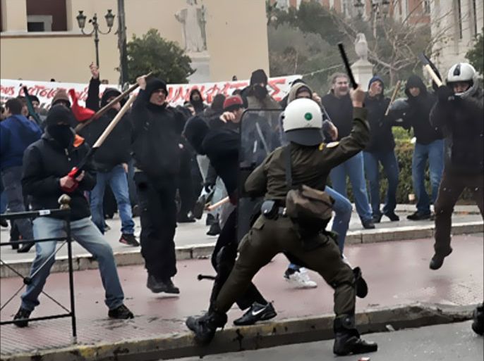 Riot police clash with protestors in central Athens on February 6, 2010 during a demonstration called by anti-racism groups for the legalisation of the illegal immigrants living in the country.