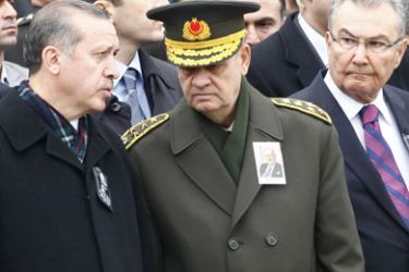 F/From left: Turkish Prime Minister Recep Tayyip Erdogan, chief of staff, General Ilker Basbug, and main opposition Republican People's Party (CHP) leader Deniz Baykal chat as they attend a funeral in Ankara on February 28, 2010. Erdogan met the head of the armed forces on February 28, two days after an Istanbul court charged two retired generals with an alleged 2003 military plot to overthrow the conservative Islamic government. AFP PHOTO / ADEM ALTAN