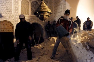 afp : Moroccan volunteers of the 'Medina' help rescue workers to look for survivors and bodies after the minaret of a mosque collapsed during weekly Friday prayers in Morocco's