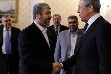 afp : Russian Foreign Minister Sergei Lavrov (R) shakes hands with exiled Hamas leader Khaled Mechaal (L) in Moscow on February 8, 2010. Mechaal arrived for high-level