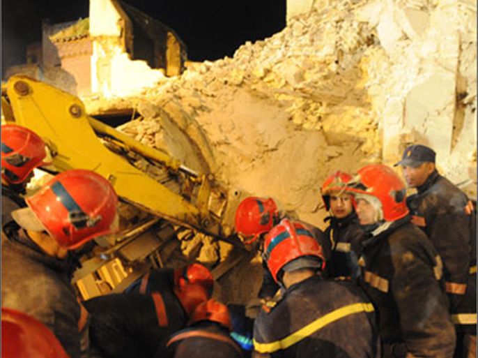 Firefighters try to rescue injured locals after the minaret of a mosque collapsed during weekly Friday prayers in Morocco's central town of Meknes on February 19, 2010 killing 36 and injuring 71 people