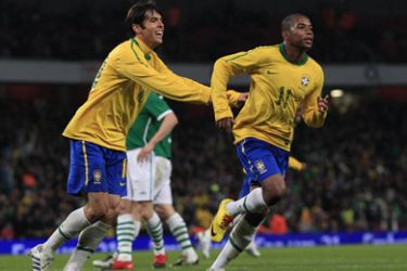 Brazil's Robinho celebrates his goal against Ireland with Kaka during their international friendly soccer match at the Emirates Stadium in London March 2, 2010.