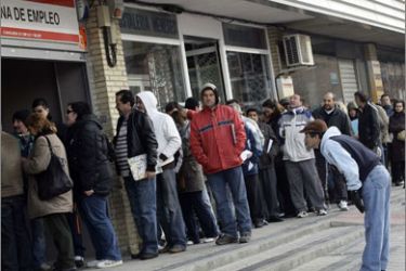 People wait in line to enter a government job centre in Madrid March 2, 2010