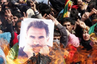 A demonstrator holds a portrait of jailed Kurdistan Workers' Party (PKK) leader Abdullah Ocalan during a gathering to celebrate Newroz in the southeastern