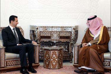 afp : A handout picture released by the Syrian Arab News Agency (SANA) shows Syria's President Bashar al-Assad (L) during a meeting with Saudi Foreign Minister Prince Saud al-