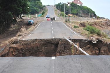 A gap in a road caused by Saturday's earthquake and the ensueing tsunami that killed at least 723, in Pulluhue, 320 km south of Santiago, march 2, 2010. World governments