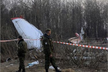 Soldiers of the Russian Interior Ministry stand guard on April 11, 2010 near the wreckage of a Polish government Tupolev Tu-154 aircraft which crashed on April 10 near Smolensk airport. Appalling as it