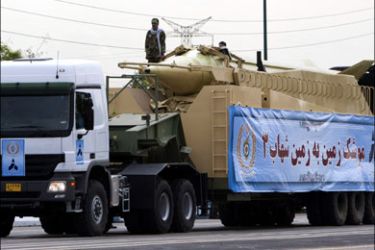 r : military vehicle carrying the Shahab 3 missile drives during a parade to commemorate the anniversary of army day in Tehran April 18, 2010. REUTERS/Morteza Nikoubazl (IRAN -