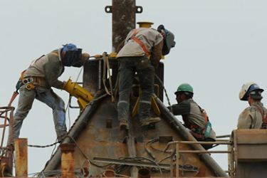 Welders at work on the Pollution Control Dome being built by steelworkers at the Martin Terminal worksite in Port Fourchon, as BP rushes to cap the source of the oil slick from the BP Deepwater Horizon platform disaster in Louisiana, on May 3, 2010.