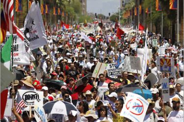 REUTERS/ Demonstrators protest against Arizona's controversial immigration law as they march to the State Capitol in Phoenix May 29, 2010. Angered by Arizona's crackdown on