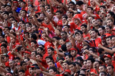 Egypt's Al-Ahly fans cheer for their team before the start of their African Champions League third round second leg football match against Libya's Al-Ittihad in Cairo on May 9, 2010.