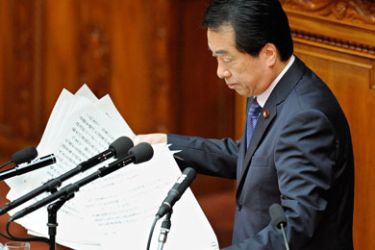 F/Japan's new Prime Minister Naoto Kan collects his notes after delivering a speech at the Diet in Tokyo on June 11, 2010 Kan pledged a fiscal policy overhaul to reduce the country's massive public debt mountain, warning of a Greece-style meltdown. AFP PHOTO/Toru YAMANAKA