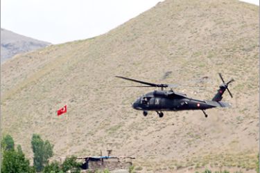AFP - An helicopter from the Turkish security forces hovers a hill in Hakkari province, southeastern Turkey, on June 19, 2010. Turkish troops and Kurdish militants